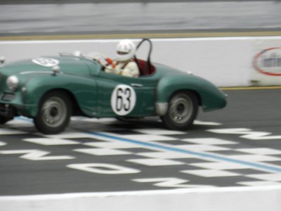 Scott Renner crossing the finish line at Infineon track during Sonoma Historic Race.