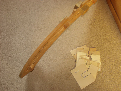 Jig standing on its edge and showing a glimpse of the blocks on the far side (to make the Left hand column).